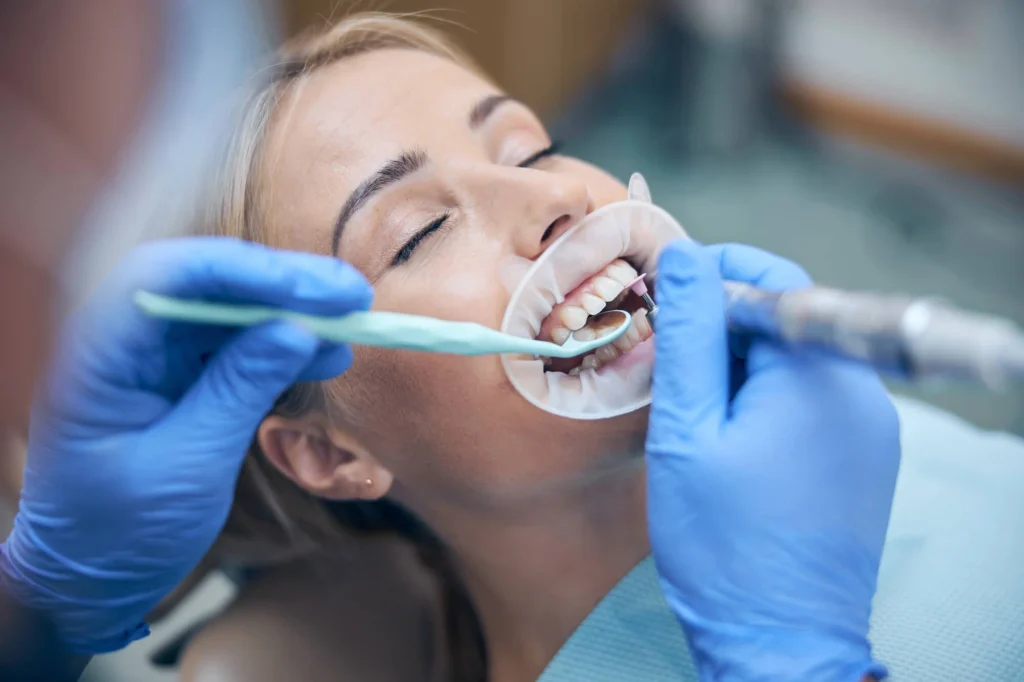 Female patient using nitrous oxide for sedation dentistry in New York City.