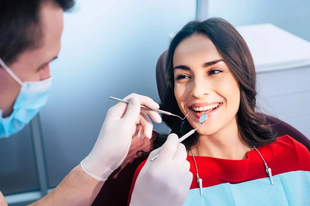 Woman relaxed during exam with a PTSD dentist in NYC.