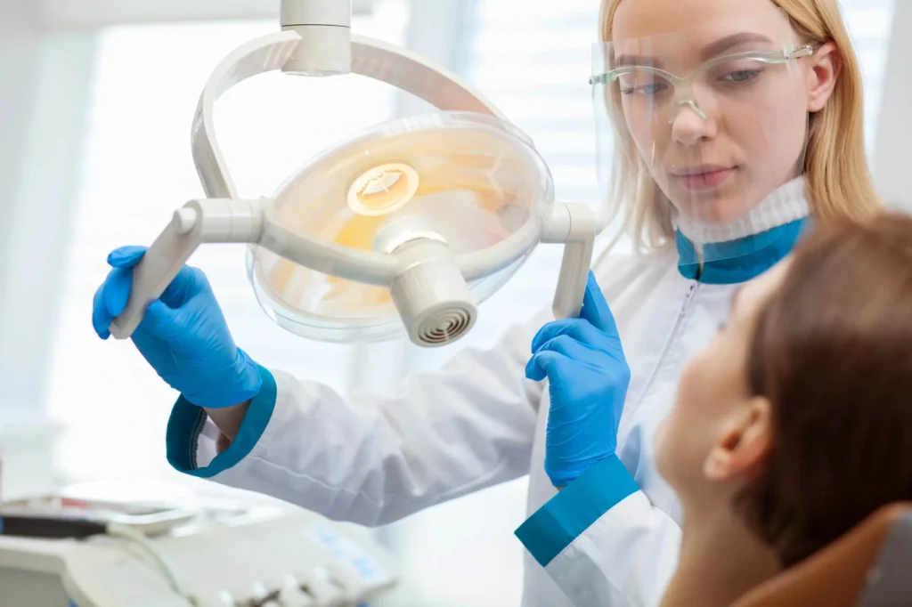 Emergency dentist examining a patient with Dental Anxiety NYC